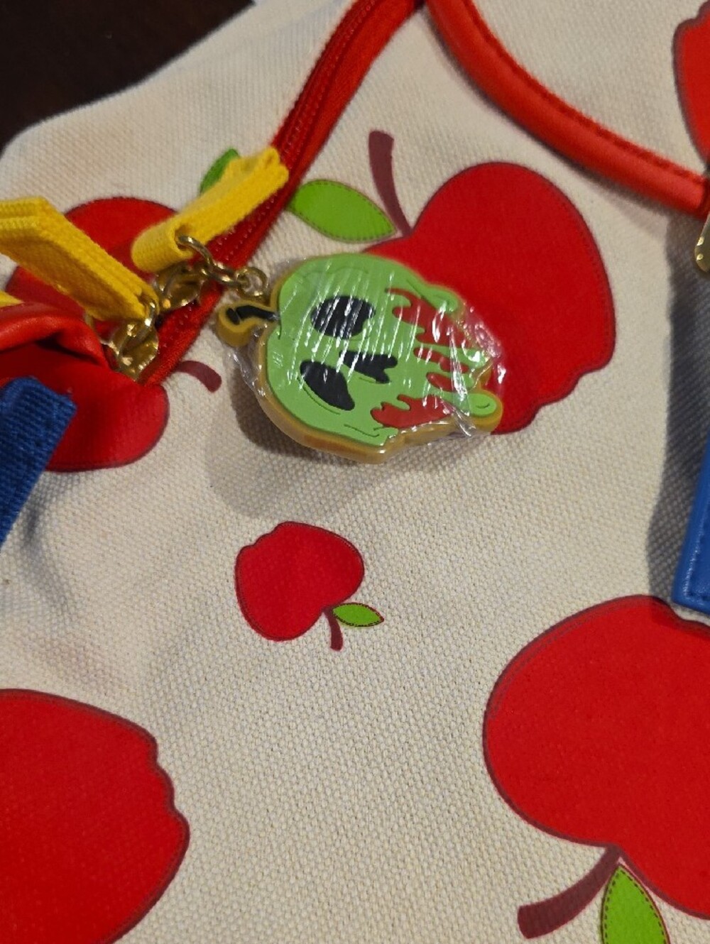 (J51) Disney Cream Backpack with Red Apple Print and Blue Strap - Picture 3 of 6